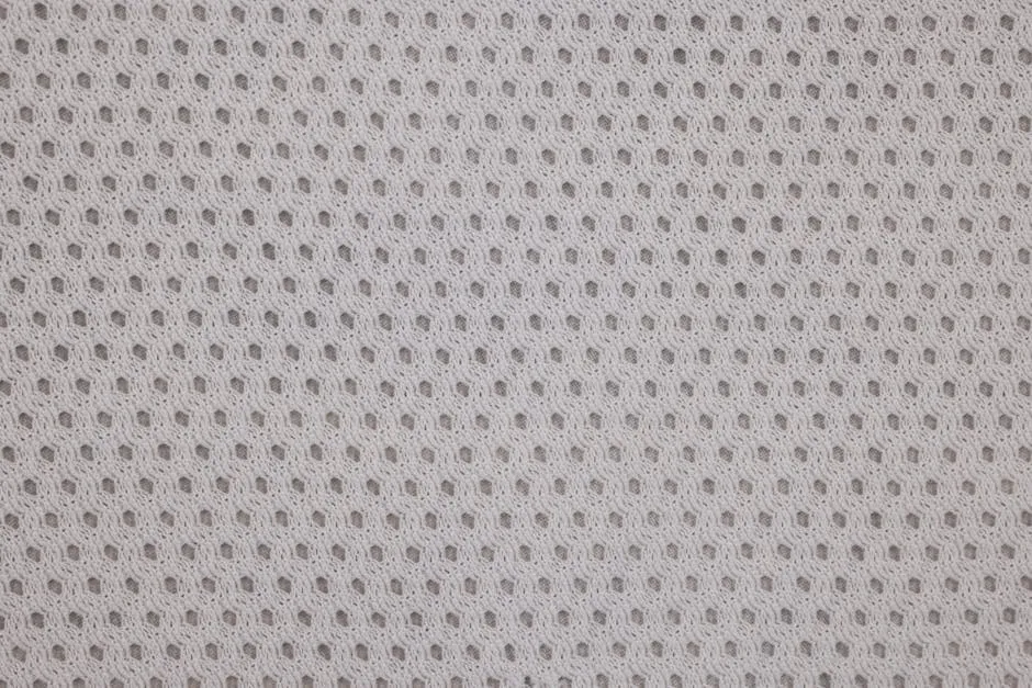 A White Fabric with Holes in Close-up Shot