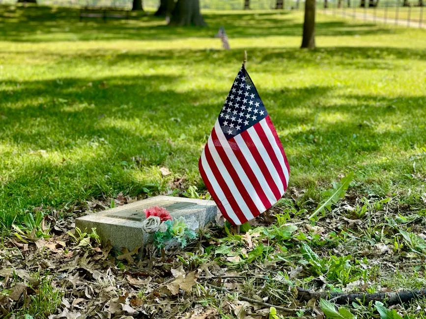 Small USA Flag Hoisted on a Grave