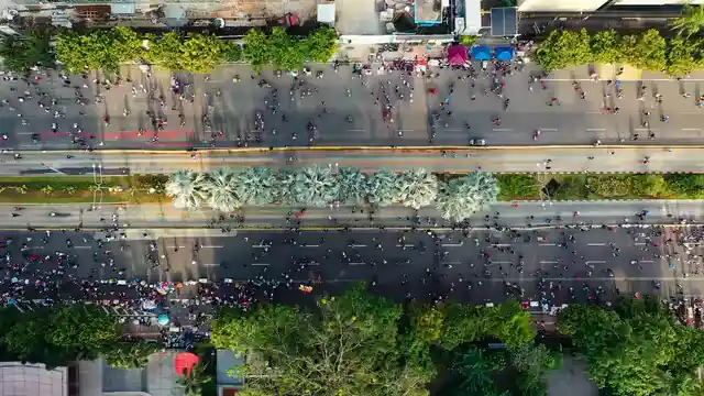 Horizontal video: Aerial view of people walking in the streets 2088290. Duration: 37 seconds. Resolution: 3840x2160