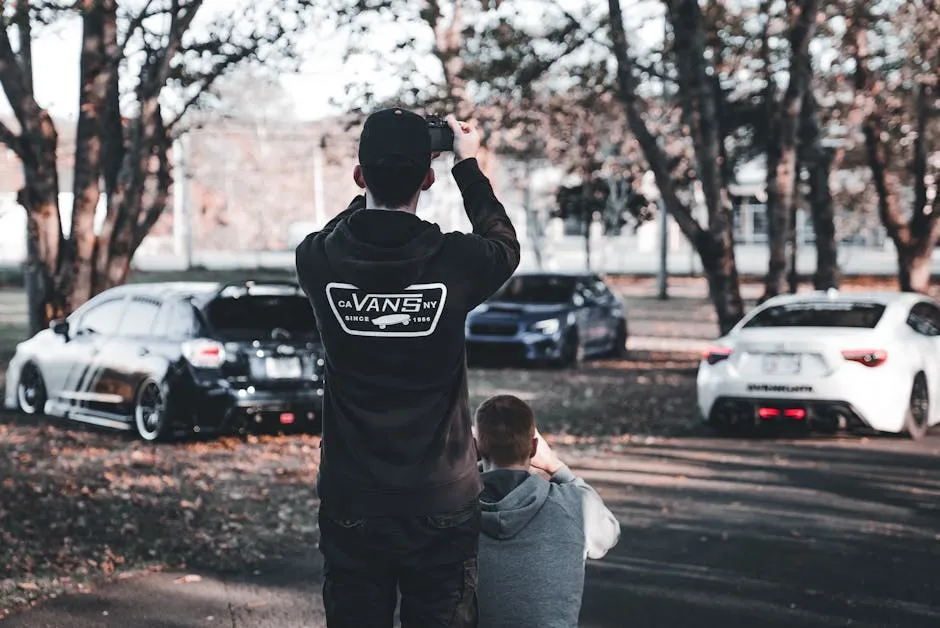 Photographer Capturing Stylish Cars Outdoors