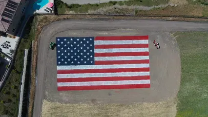 Horizontal video: A giant american flag landscape on an open field 5040561. Duration: 17 seconds. Resolution: 1920x1080