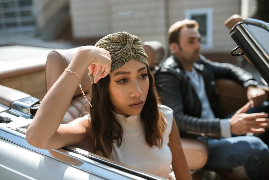 Woman in White Tank Top Sitting In A Car Feeling Annoyed