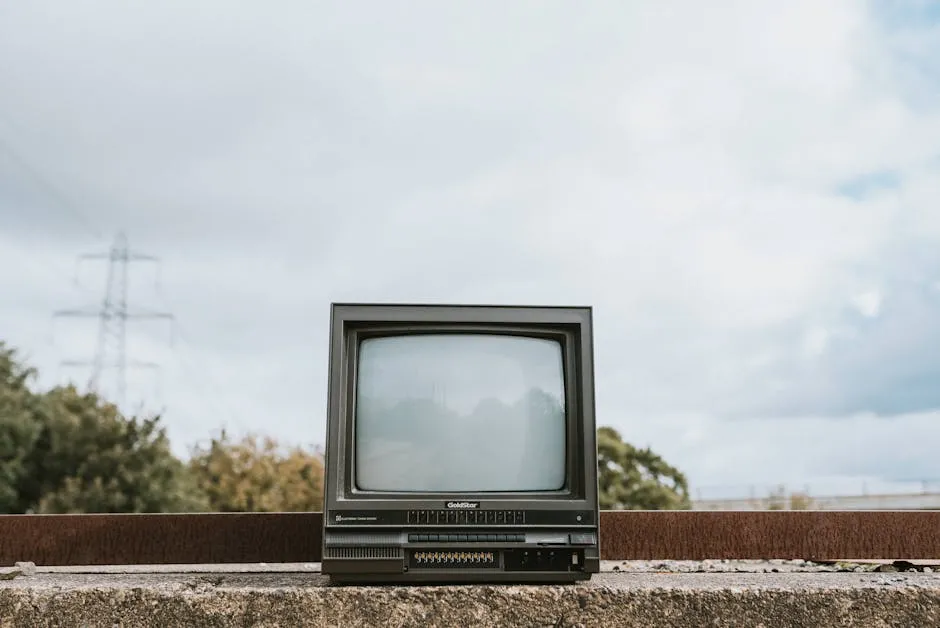Retro TV set placed on stone surface