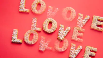 Horizontal video: Kaleidoscope effect on the phrase love ya spelled out in cookies 5897833. Duration: 14 seconds. Resolution: 3840x2160