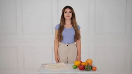 Horizontal video: Woman using sign language and picking up a cloth on the table 10374283. Duration: 15 seconds. Resolution: 1920x1080