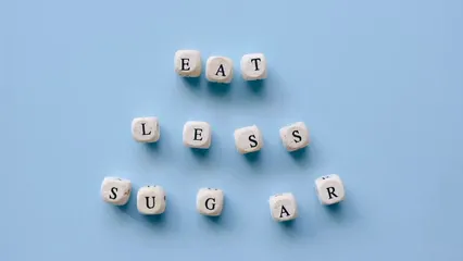 Horizontal video: Eat less sugar spelled out using dice 6941895. Duration: 15 seconds. Resolution: 1920x1080