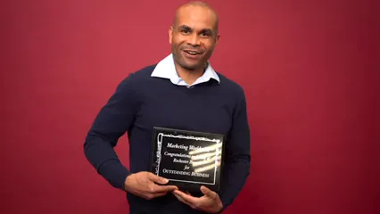 Horizontal video: A man showing his award 7005885. Duration: 10 seconds. Resolution: 3840x2160