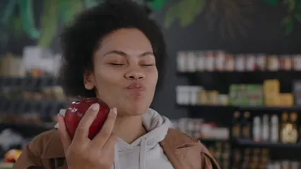 Horizontal video: A woman earing an apple 8027661. Duration: 27 seconds. Resolution: 1920x1080