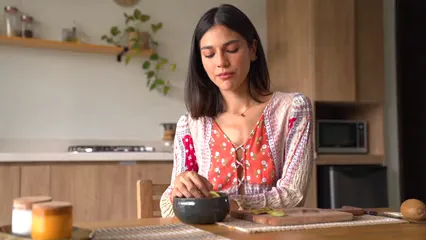 Horizontal video: A woman eating a slice of kiwi 8447130. Duration: 13 seconds. Resolution: 1920x1080