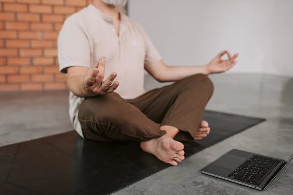 Person Doing Yoga in Front of a Laptop