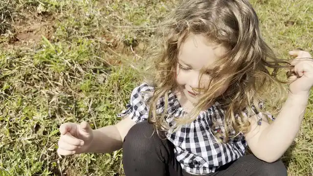Horizontal video: Child and cat enjoying playtime outdoors 28995337. Duration: 22 seconds. Resolution: 3840x2160