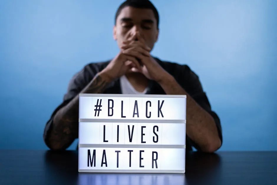 Man Behind a Black Lives Matter Sign