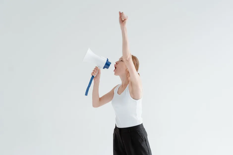 Woman in White Tank Top Shouting Using Megaphone