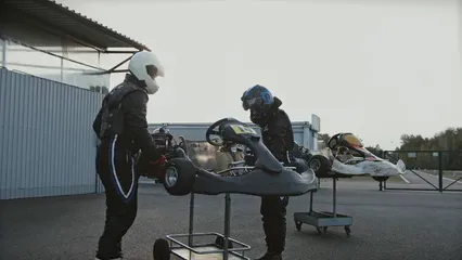 Horizontal video: Drivers getting cars ready for the race 5638007. Duration: 14 seconds. Resolution: 3840x2160