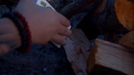 Horizontal video: Man starting a bonfire 7147632. Duration: 22 seconds. Resolution: 3840x2160