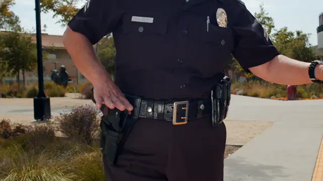 Horizontal video: Police officer working 7714002. Duration: 10 seconds. Resolution: 3840x2160