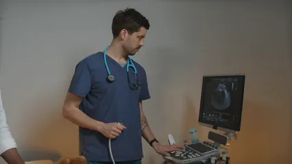 Horizontal video: Man operating ultrasound computer 6235189. Duration: 26 seconds. Resolution: 3840x2160