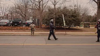 Horizontal video: Police officers in full gear walking in the street 6581398. Duration: 21 seconds. Resolution: 3840x2160