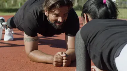 Horizontal video: Man exercising with a personal trainer 8343373. Duration: 15 seconds. Resolution: 2688x1512