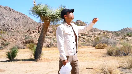 Horizontal video: A man under the heat of the sun takes a drink from a gallon of water 3051721. Duration: 16 seconds. Resolution: 1920x1080