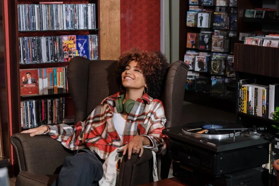 A Woman with Curly Hair Listening to Music