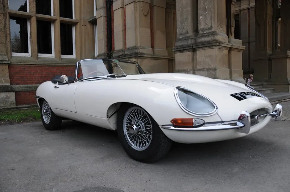 White Jaguar E-Type Parked Near Concrete Building