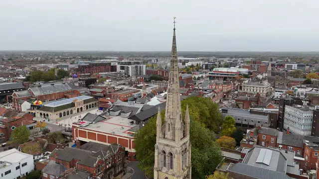 Horizontal video: Aerial view of city skyline featuring prominent church spire 29040359. Duration: 28 seconds. Resolution: 3840x2160