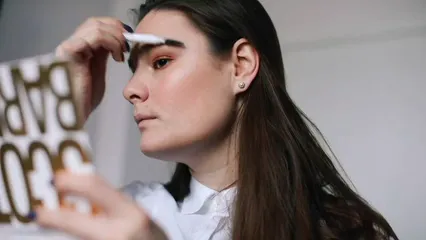 Horizontal video: A woman applying make up on her eyebrow 3971911. Duration: 28 seconds. Resolution: 1920x1080