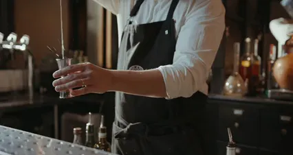 Horizontal video: A man in a black apron pouring a drink 4667164. Duration: 13 seconds. Resolution: 4096x2160