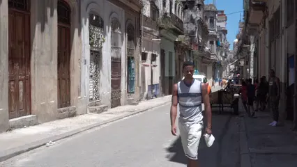 Horizontal video: Man driving an orange vintage car 4768667. Duration: 25 seconds. Resolution: 3840x2160