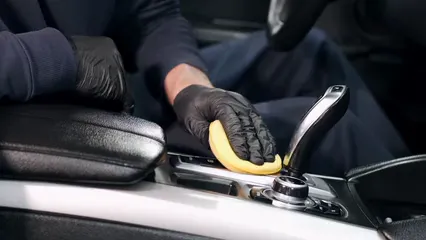 Horizontal video: Person cleaning the gear shifter 4822919. Duration: 11 seconds. Resolution: 3840x2160