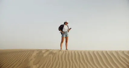 Horizontal video: A woman trying to get a signal on her phone 8865369. Duration: 17 seconds. Resolution: 4096x2160