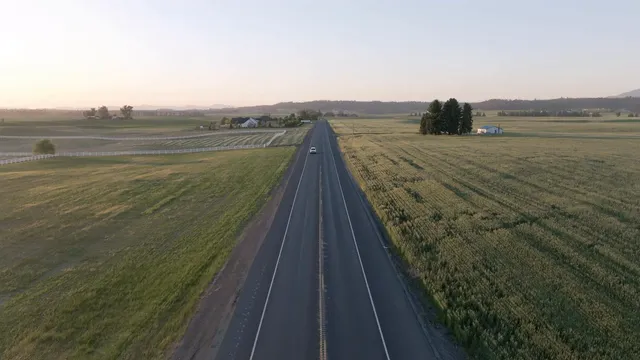 Horizontal video: Aerial view of a highway with cars driving on it 27114560. Duration: 21 seconds. Resolution: 3840x2160