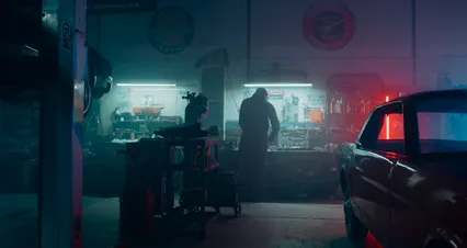 Horizontal video: A man standing in front of a car in a garage 4488720. Duration: 18 seconds. Resolution: 4096x2160