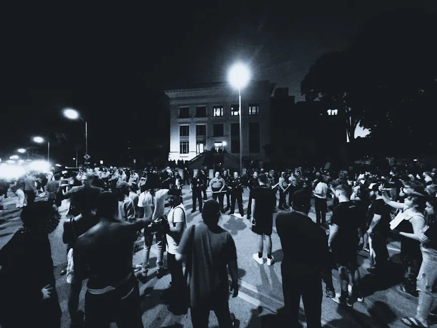 Grayscale Photo of Protesters on a Street