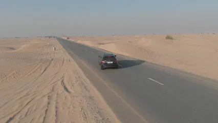 Horizontal video: Drone footage of a car on road in the middle of desert 6826177. Duration: 43 seconds. Resolution: 3840x2160