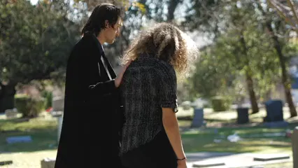 Horizontal video: Man comforting a woman at the cemetery 6840821. Duration: 37 seconds. Resolution: 1920x1080