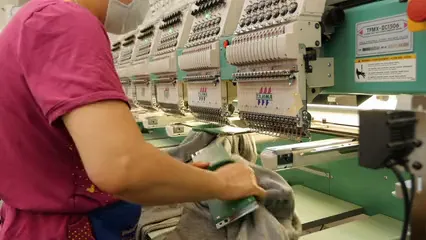 Horizontal video: A close up video of a clothing factory working 7043686. Duration: 22 seconds. Resolution: 3840x2160