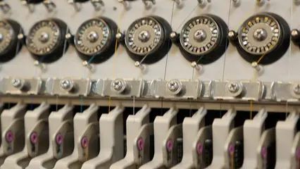 Horizontal video: Operating an embroidery sewing machine on the caps 7043757. Duration: 48 seconds. Resolution: 3840x2160