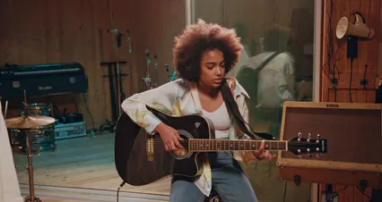 Horizontal video: A woman playing the guitar 7088388. Duration: 21 seconds. Resolution: 4096x2160