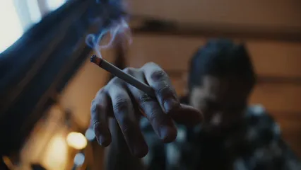 Horizontal video: Guy smoking cigarrette 7277932. Duration: 54 seconds. Resolution: 3840x2160