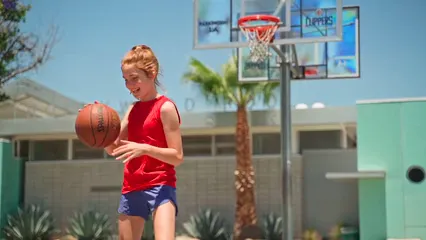 Horizontal video: A young girl with a basketball 8337084. Duration: 14 seconds. Resolution: 1920x1080