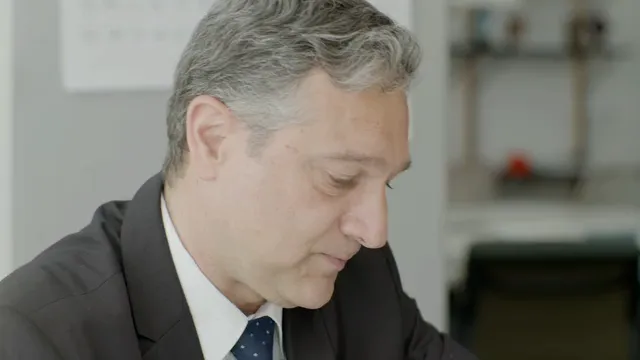Horizontal video: A man reviewing business analytics 8425713. Duration: 17 seconds. Resolution: 3840x2160