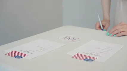 Horizontal video: Person writing down votes 8847582. Duration: 16 seconds. Resolution: 1920x1080