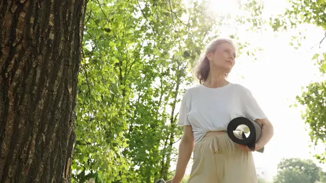 Horizontal video: Woman drinking water while holding a yoga mat 8939282. Duration: 9 seconds. Resolution: 3840x2160