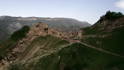 Horizontal video: Aerial footage of abandoned ancient village of top of mountain gamsutlmeer 9950834. Duration: 17 seconds. Resolution: 3840x2160