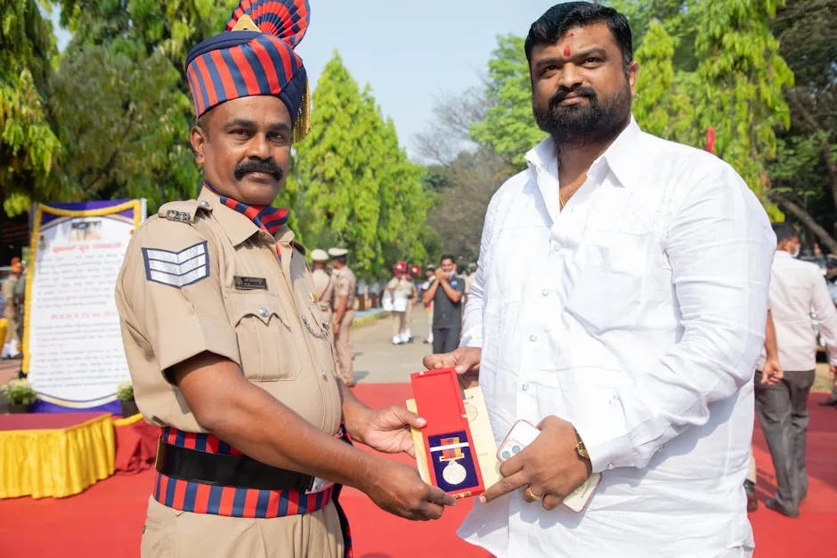 Police Academy Director Giving Medal to Bearded Man on Festival