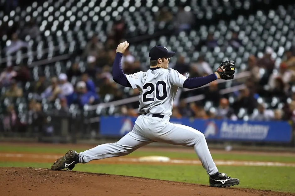 Selective Focus of Baseball Pitcher in 20 Jersey About to Throw Ball