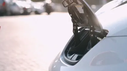 Horizontal video: A person charging an electric car 4817955. Duration: 15 seconds. Resolution: 3840x2160