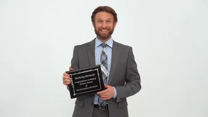 Horizontal video: A man showing his award 7006037. Duration: 8 seconds. Resolution: 3840x2160
